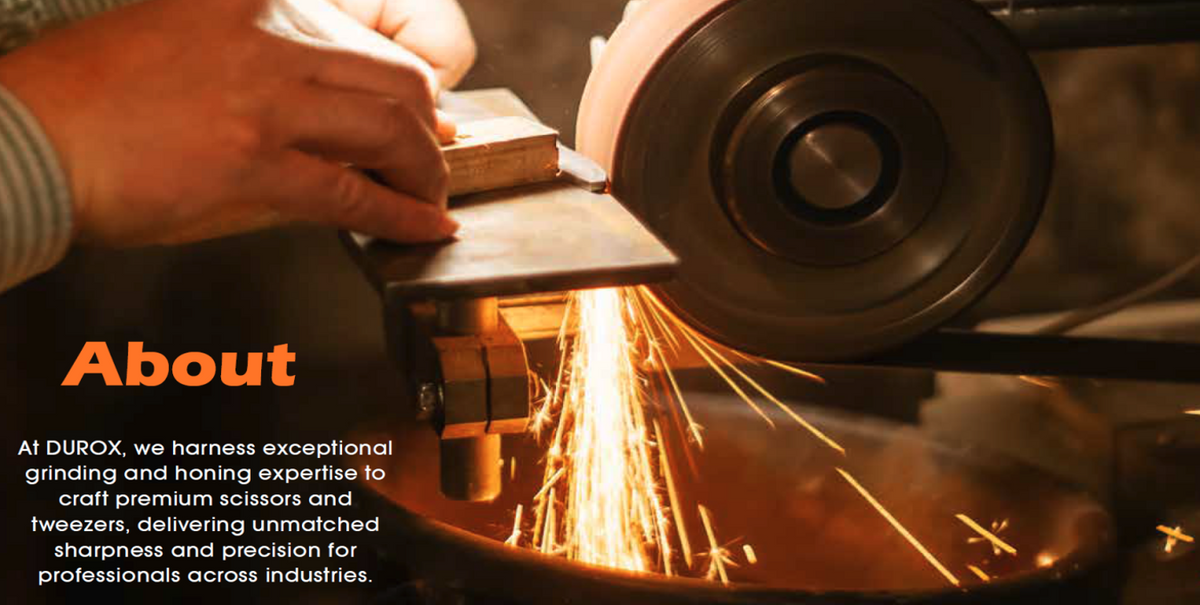Worker grinding a scissor blade
